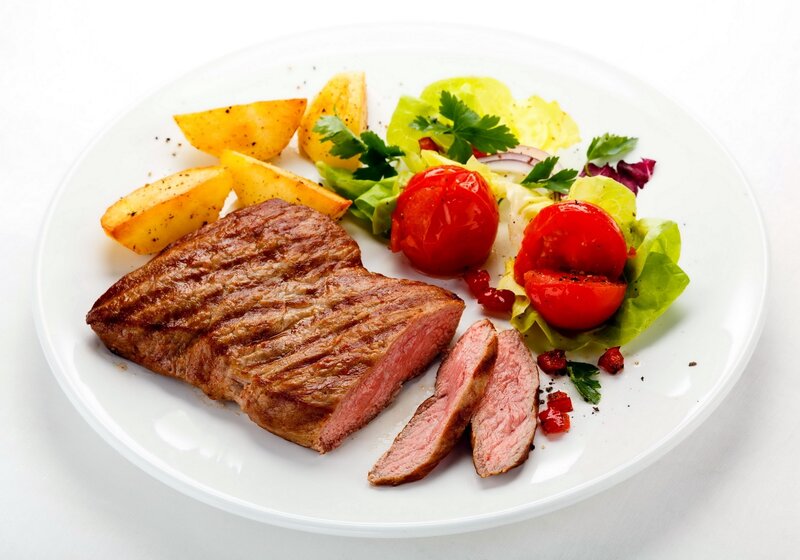 Grilled steak with potatoes and salad