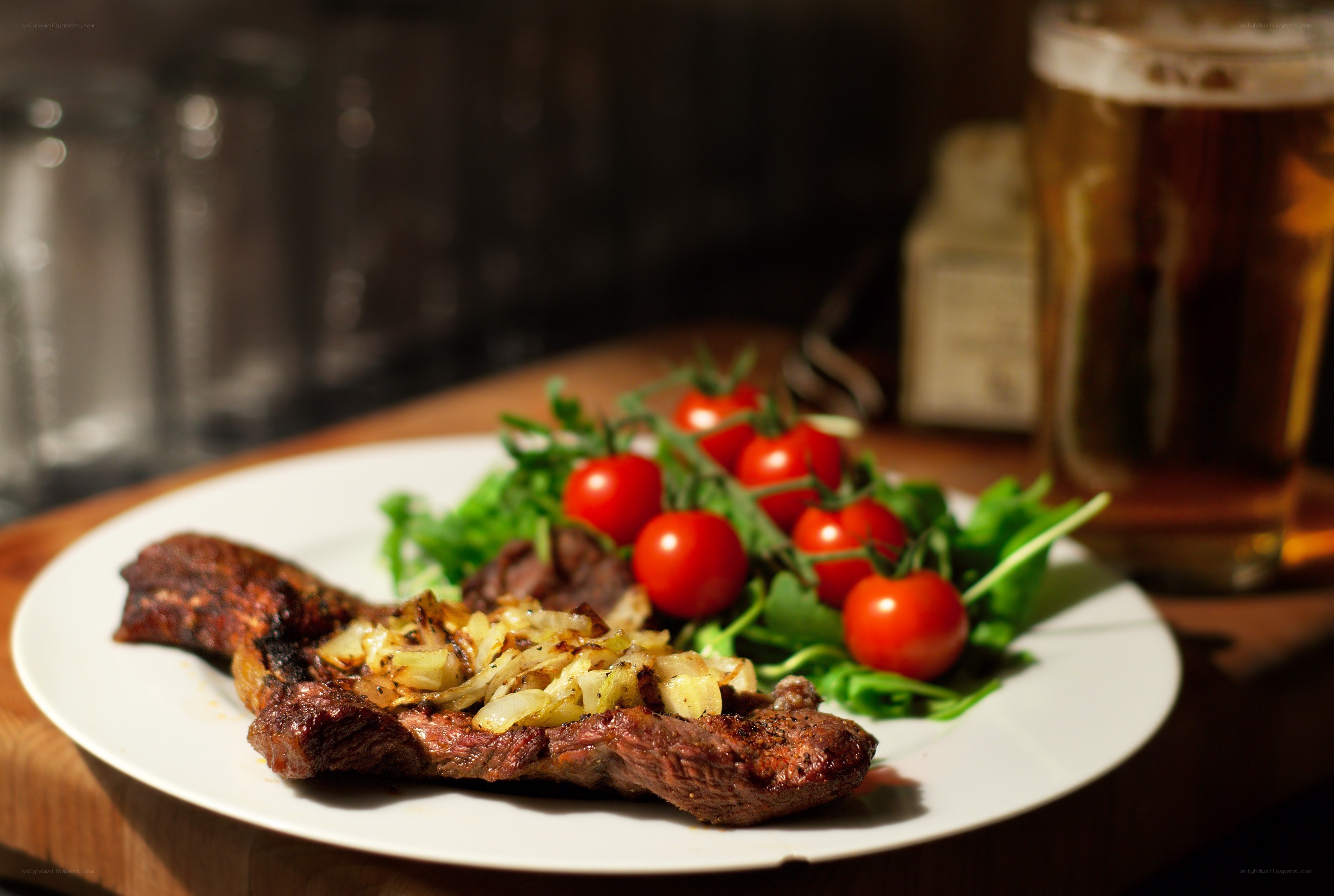 Grilled steak with salad and beer