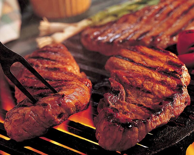 Grilled steaks on a barbecue