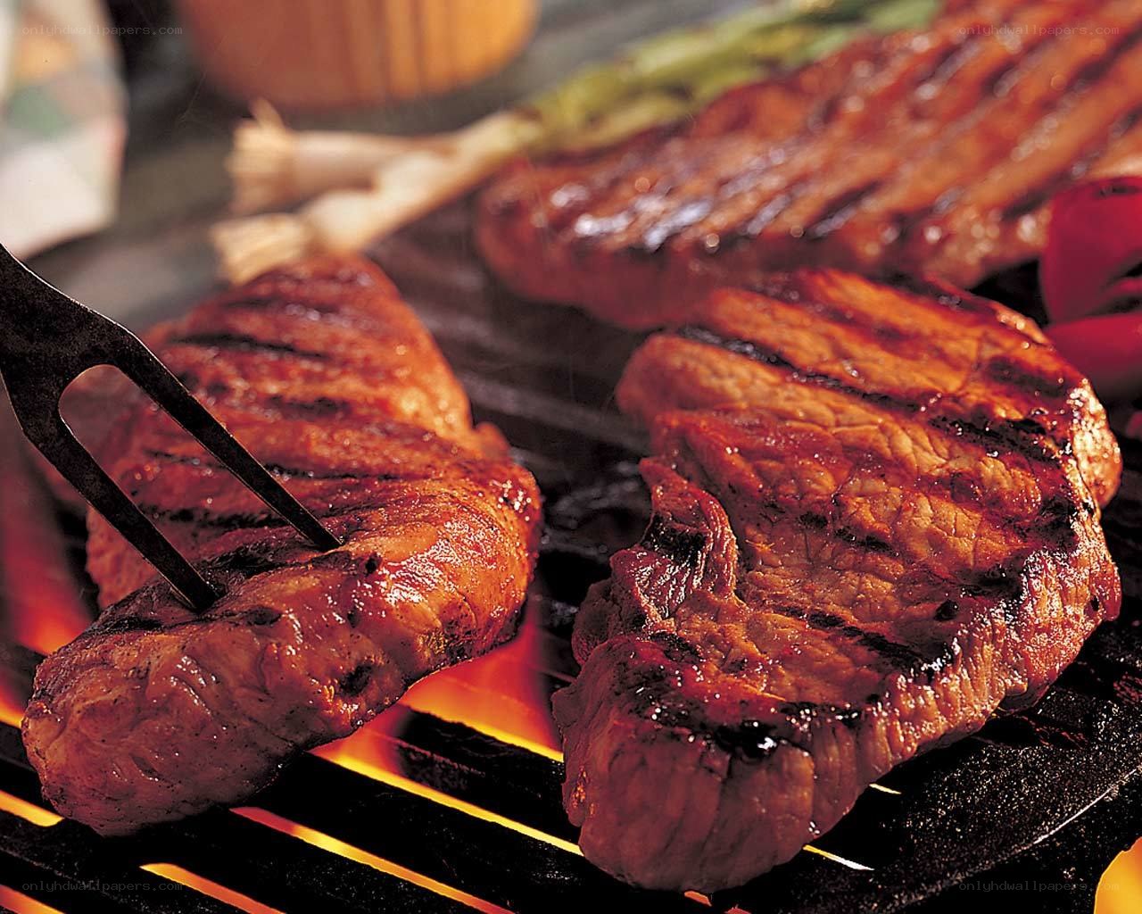 Grilled steaks on a barbecue