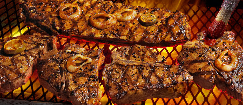 Grilled steaks on a barbecue