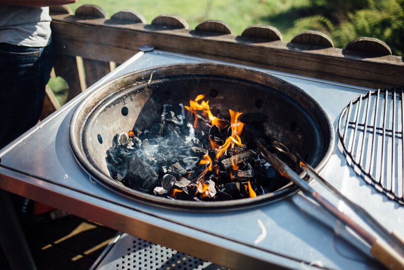 Grilling with charcoal flames