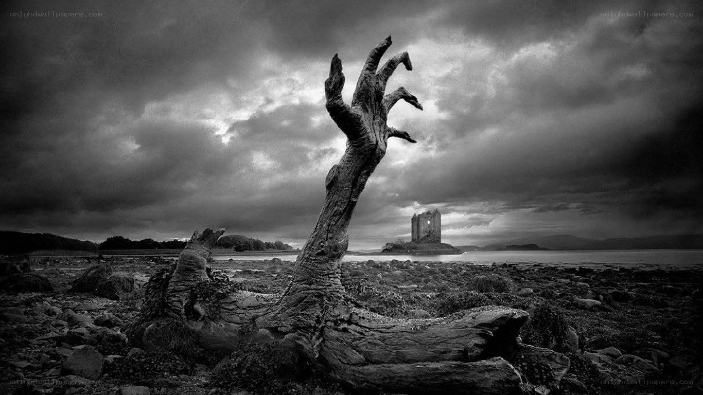Grim hand sculpture by castle