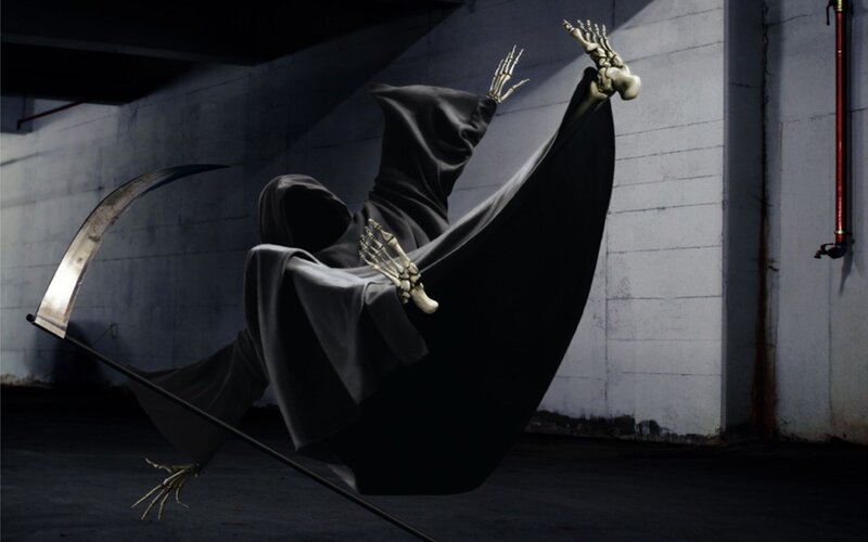 Grim Reaper in a dark alley