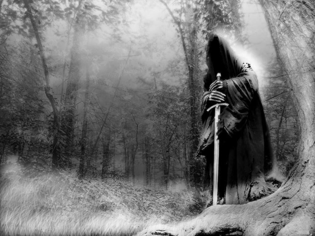 Grim reaper in misty forest