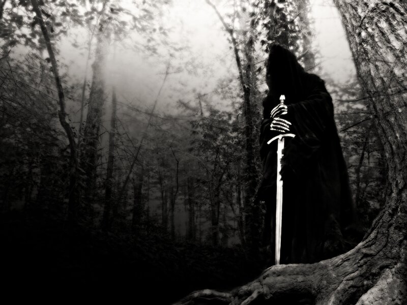 Grim reaper in misty forest