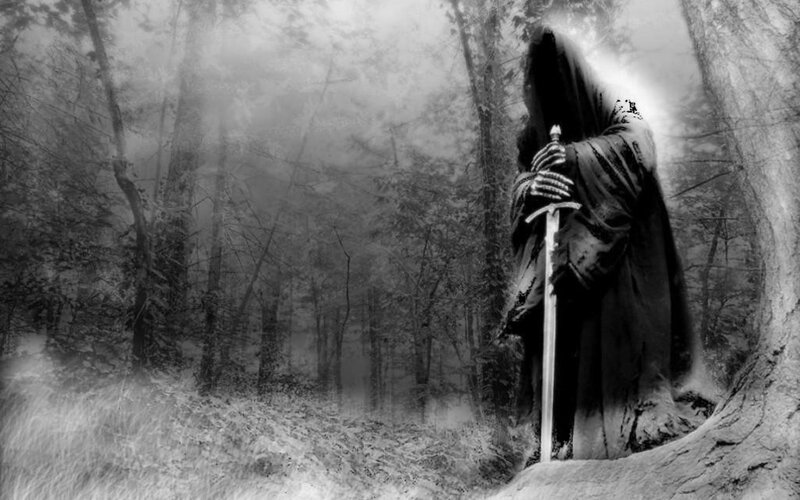 Grim reaper in misty forest