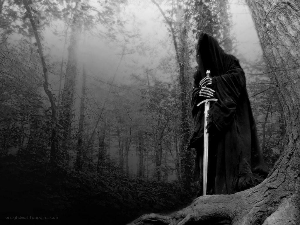 Grim reaper in misty forest