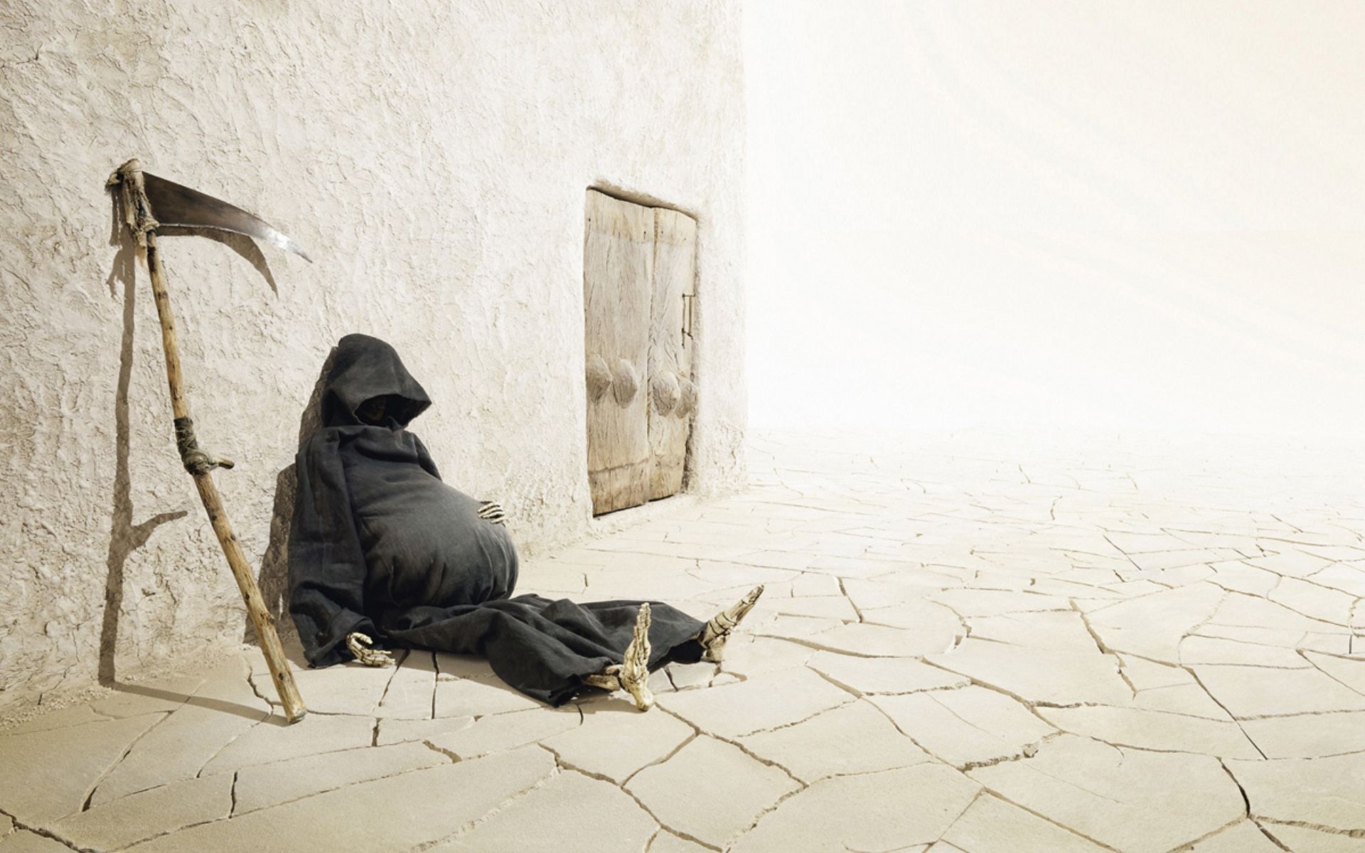 Grim Reaper resting in desert