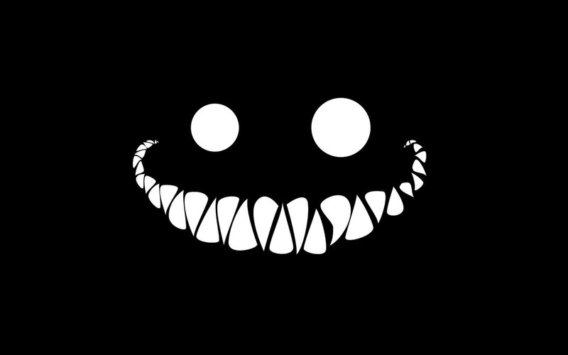 grinning face with sharp teeth