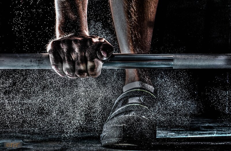 gripping barbell with powder