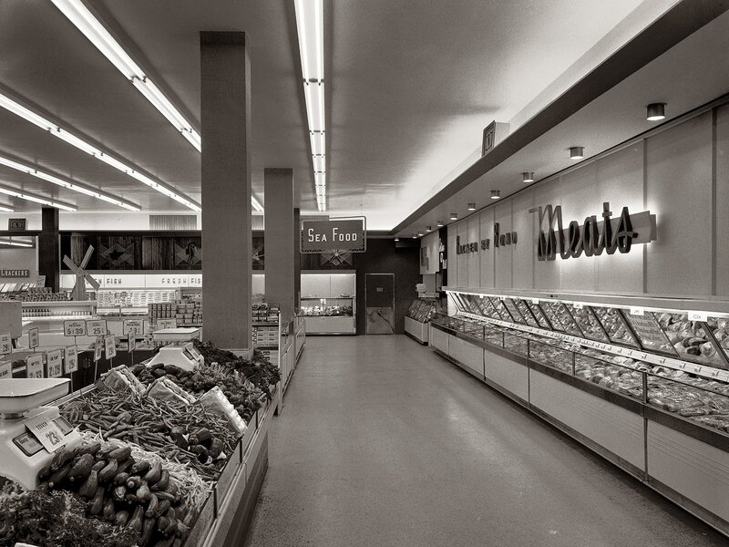 Grocery store interior with meats and produce