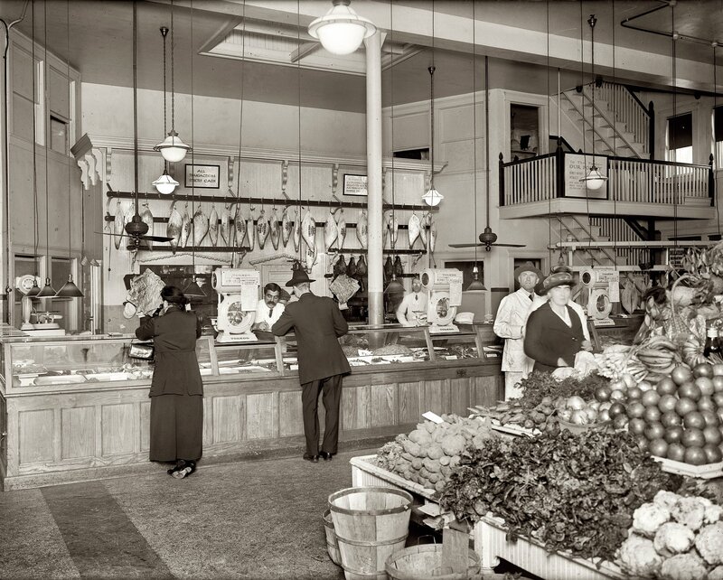 Grocery store interior with produce and fish