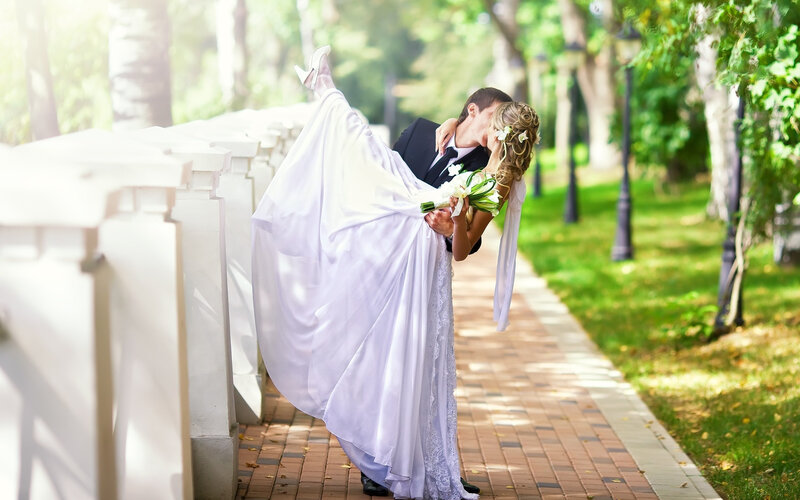 Groom Kissing Bride — White