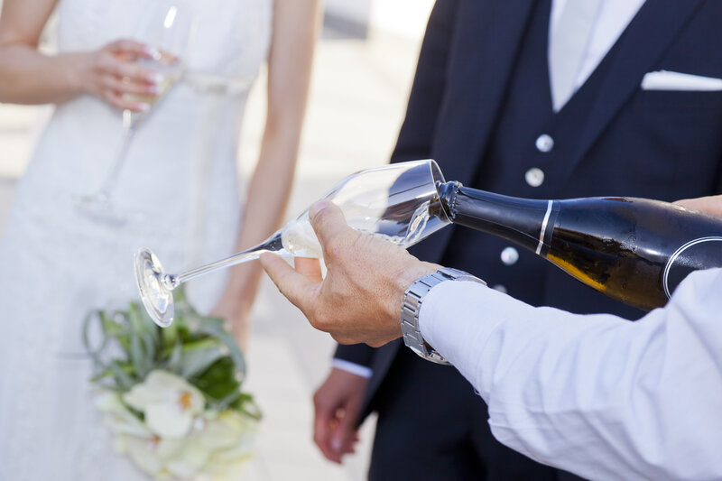 Groom Pouring Champagne