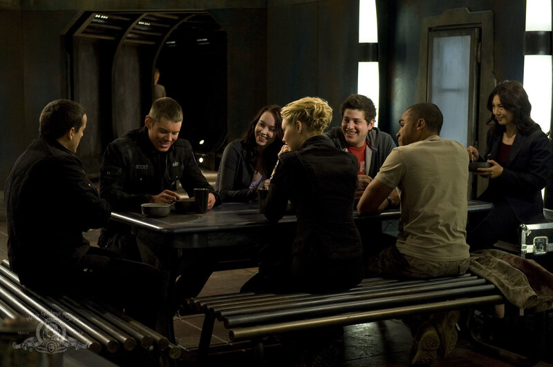 Group at a table in a sci-fi setting