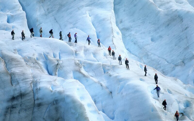 Group climbing glacier