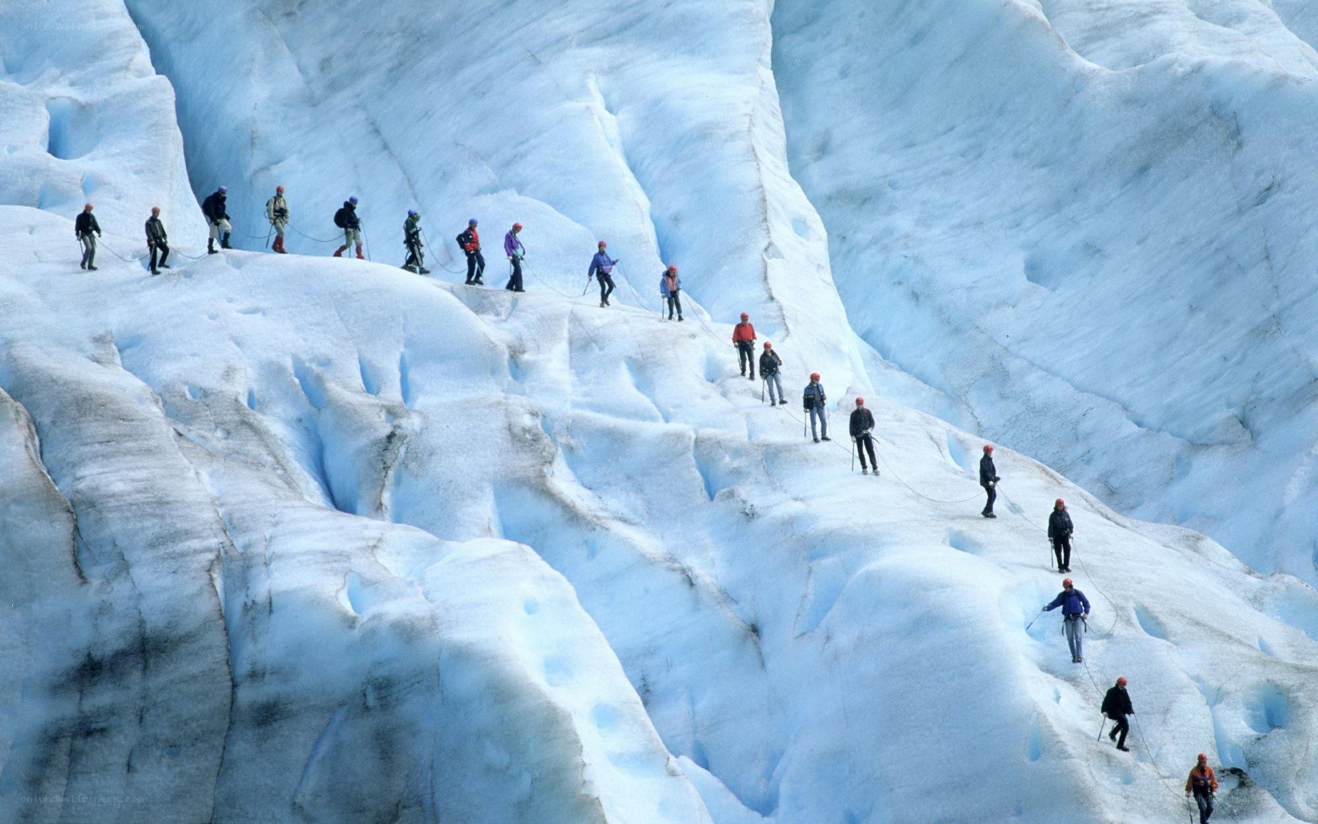 Group climbing glacier