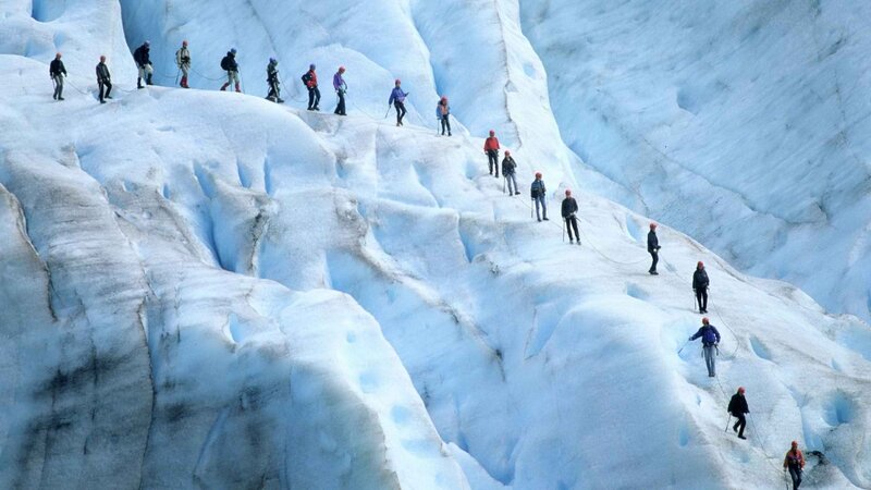 Group climbing glacier