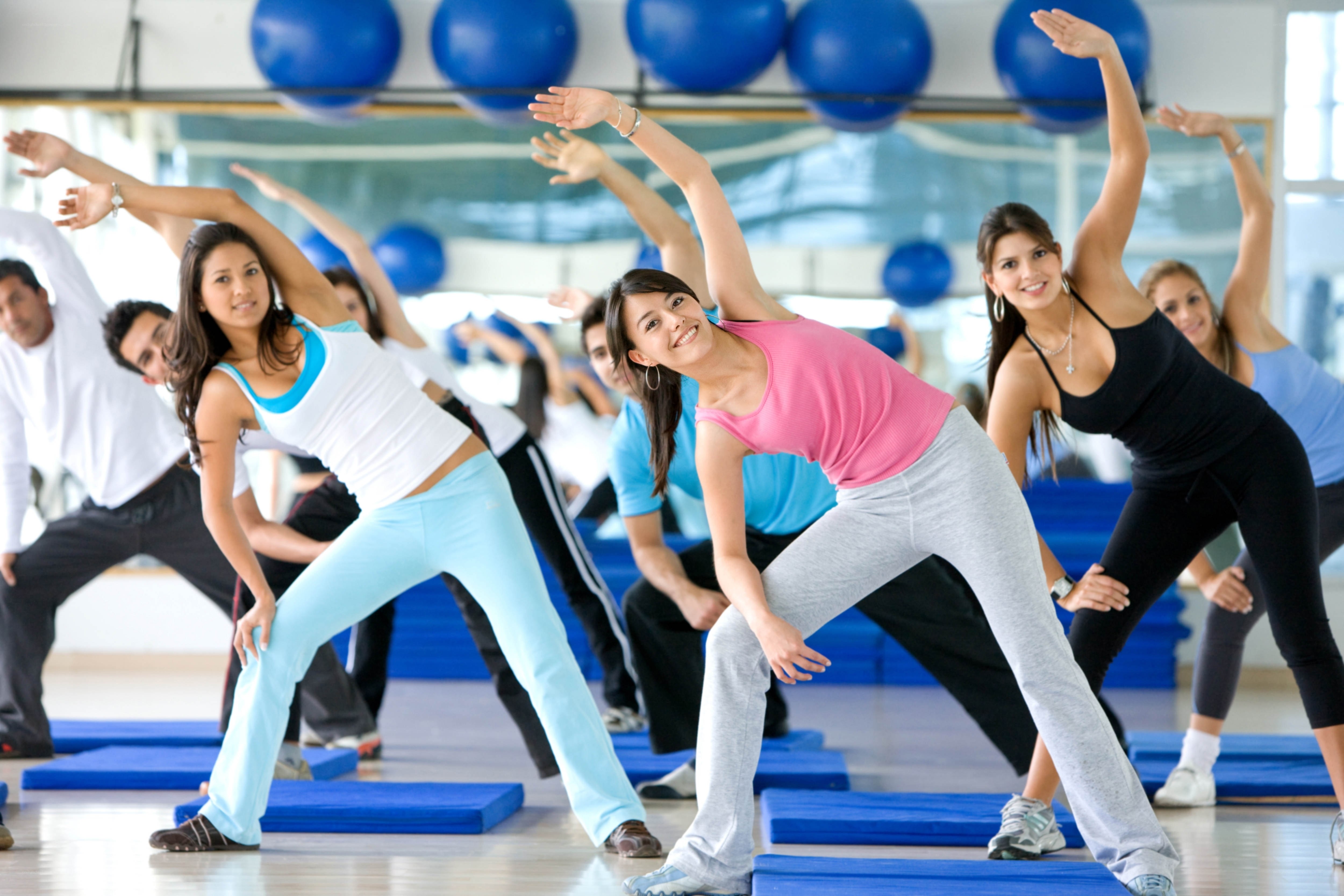 Group fitness class exercising