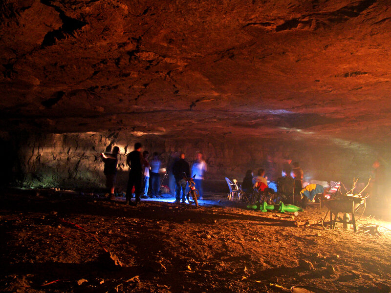Group in a cave at night