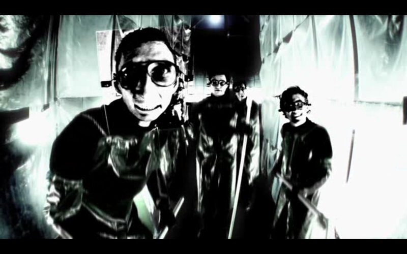 group in dark room with goggles