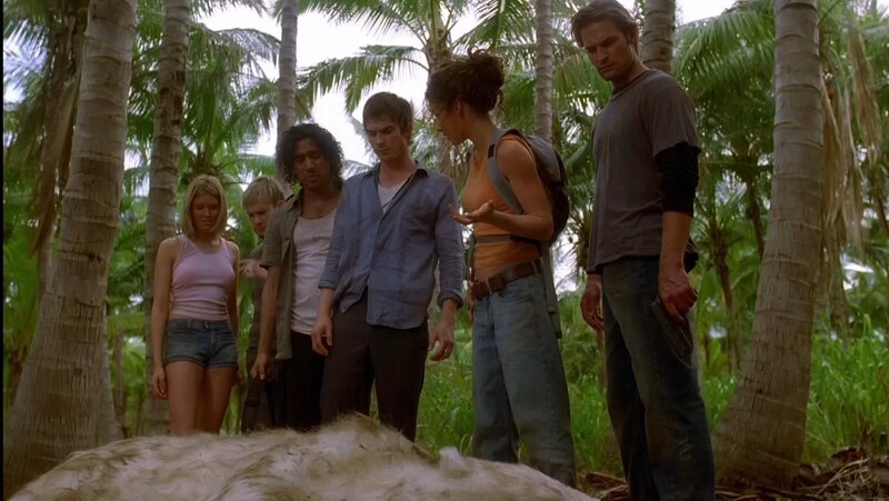 Group in jungle with animal carcass