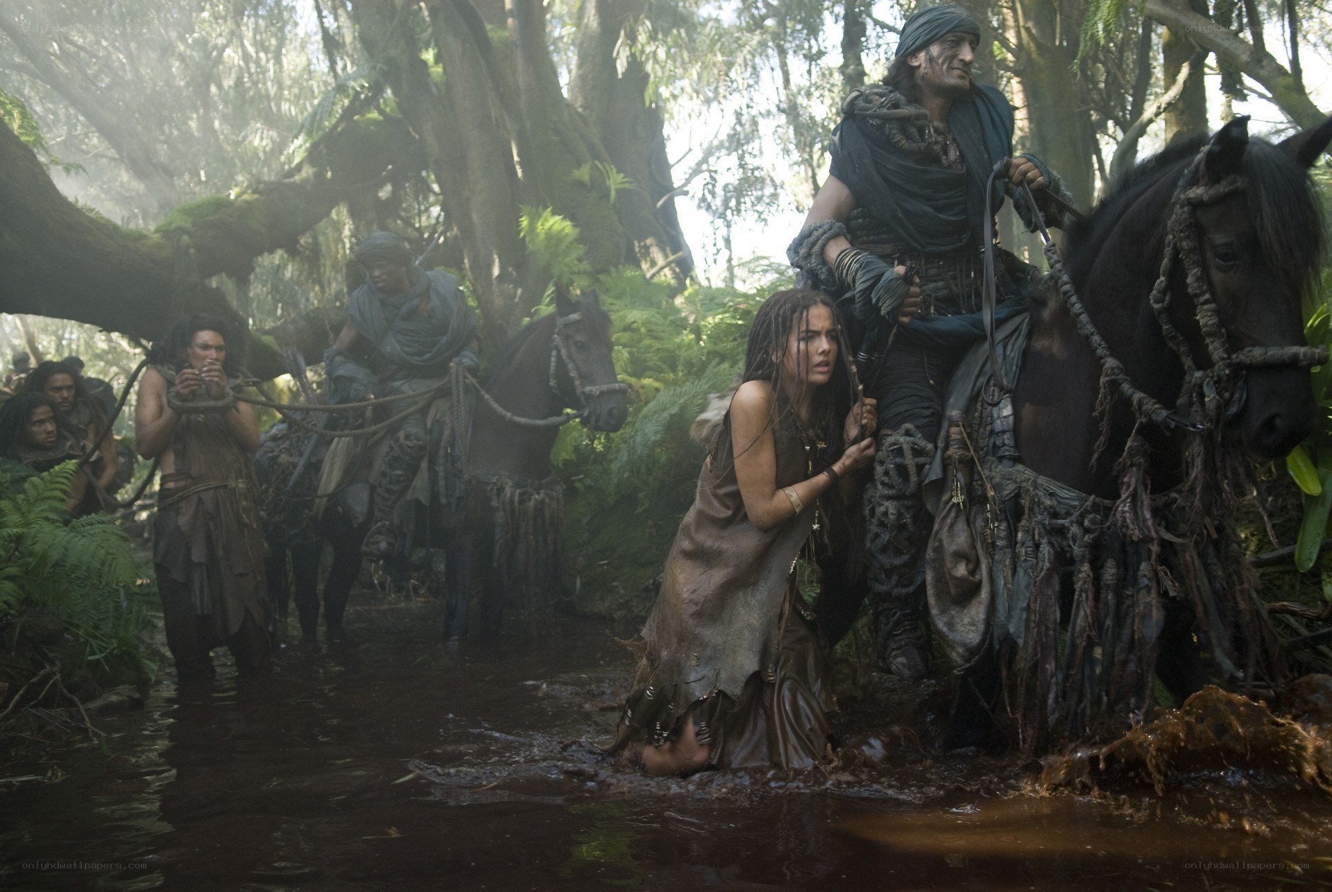 Group in muddy forest stream