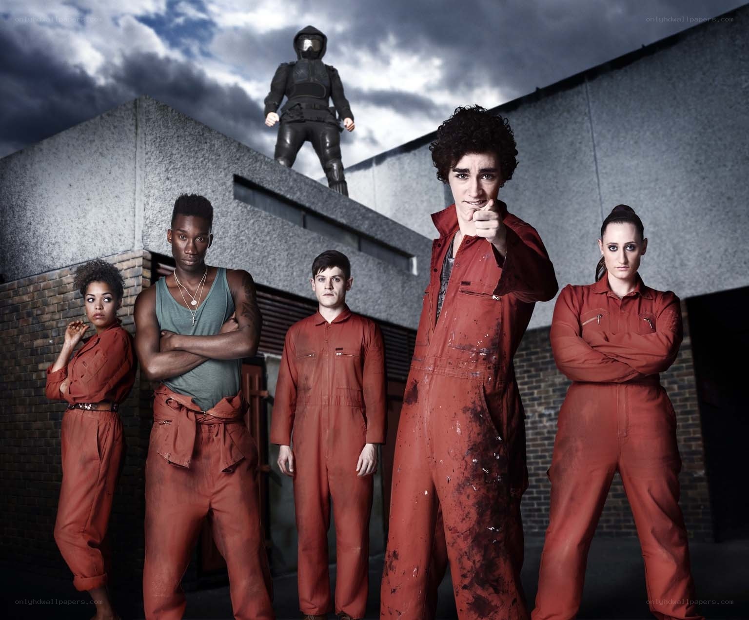 Group in red overalls with robot