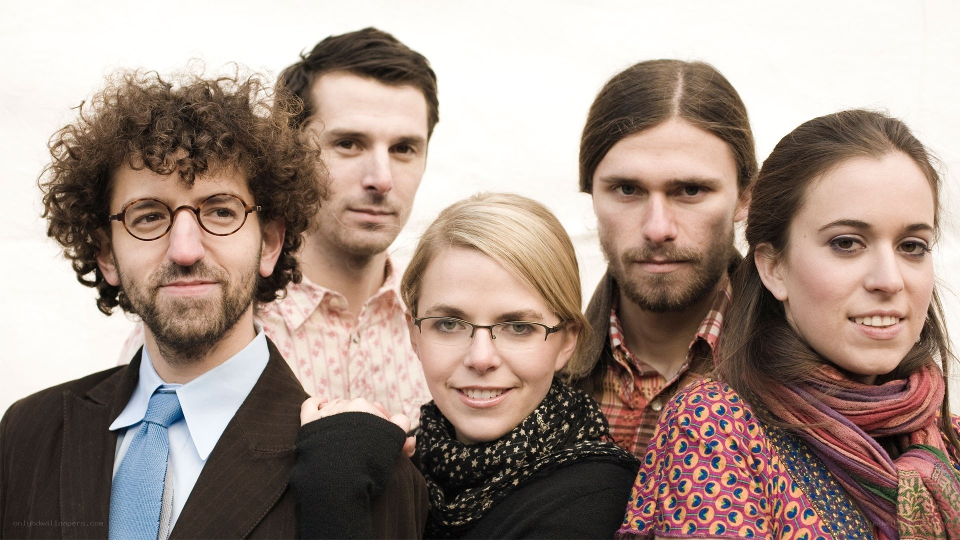 group of five people posing