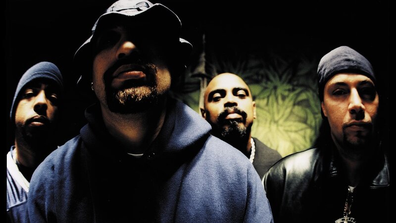 group of four men in hoodies