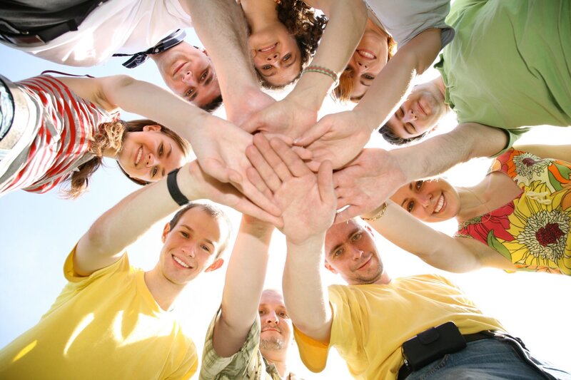 group of friends with hands together