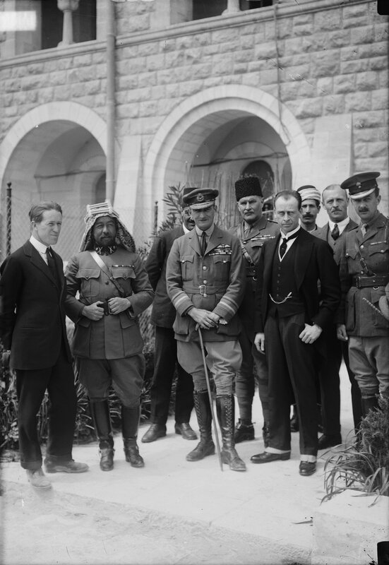Group of men in military and formal attire