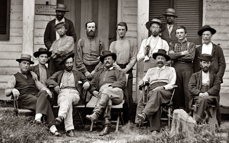 Group of men outside a post office