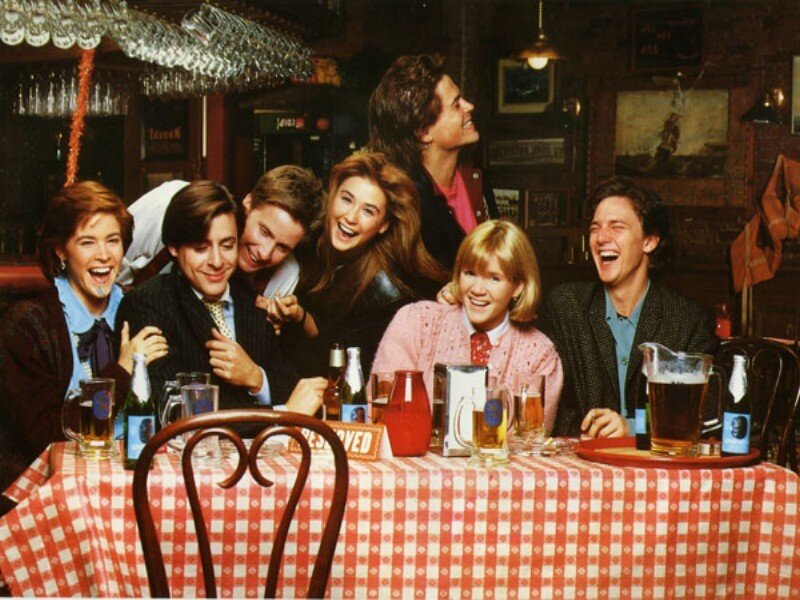Group of People at Table — Red