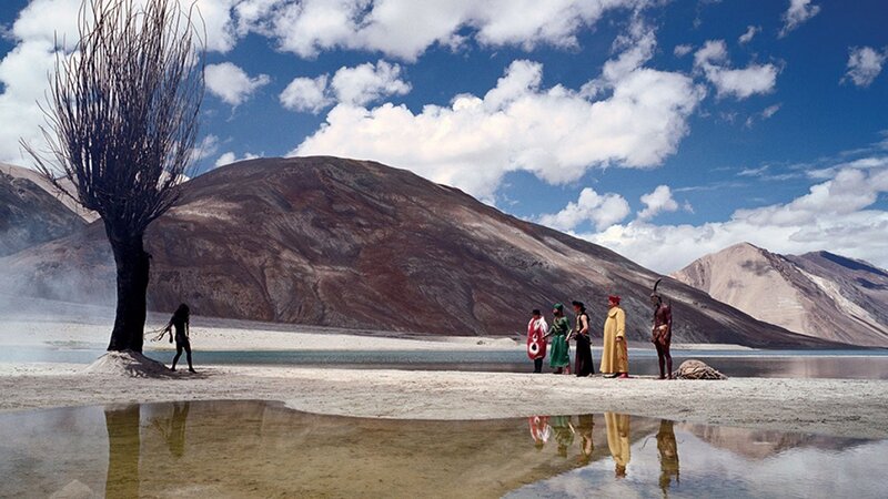 Group of people by a lake