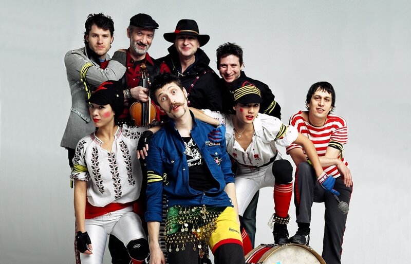 group of performers in costumes