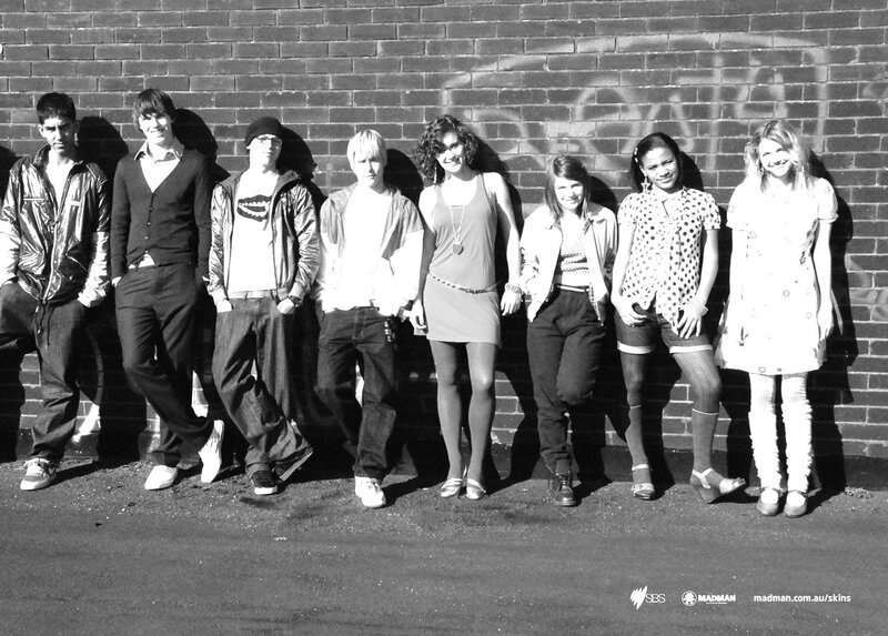 Group of teens against a brick wall