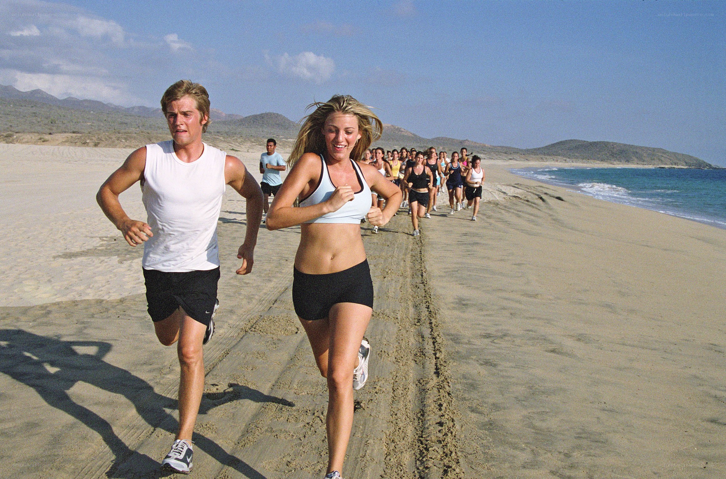 Group running on beach