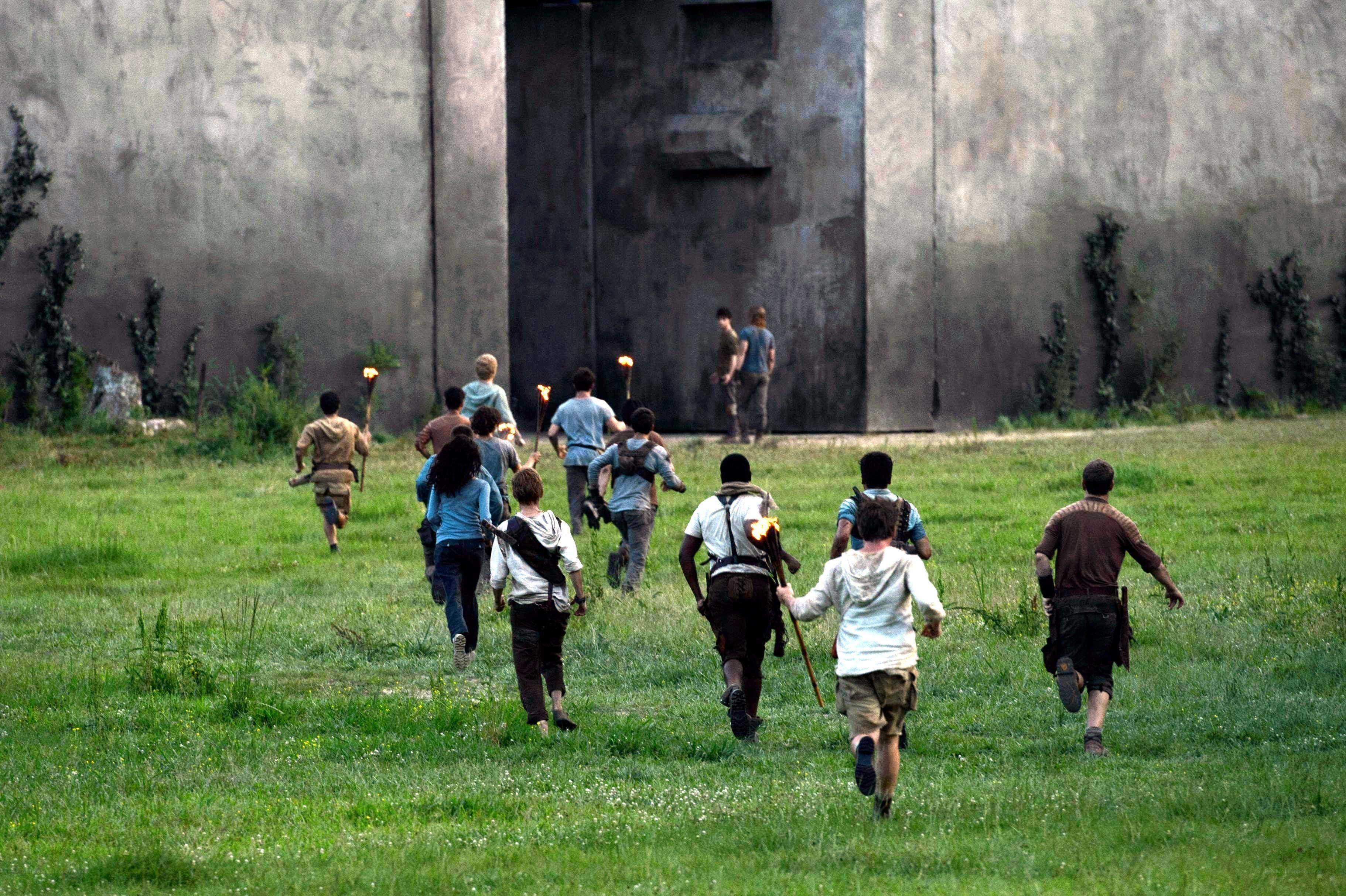 Group running toward large gate