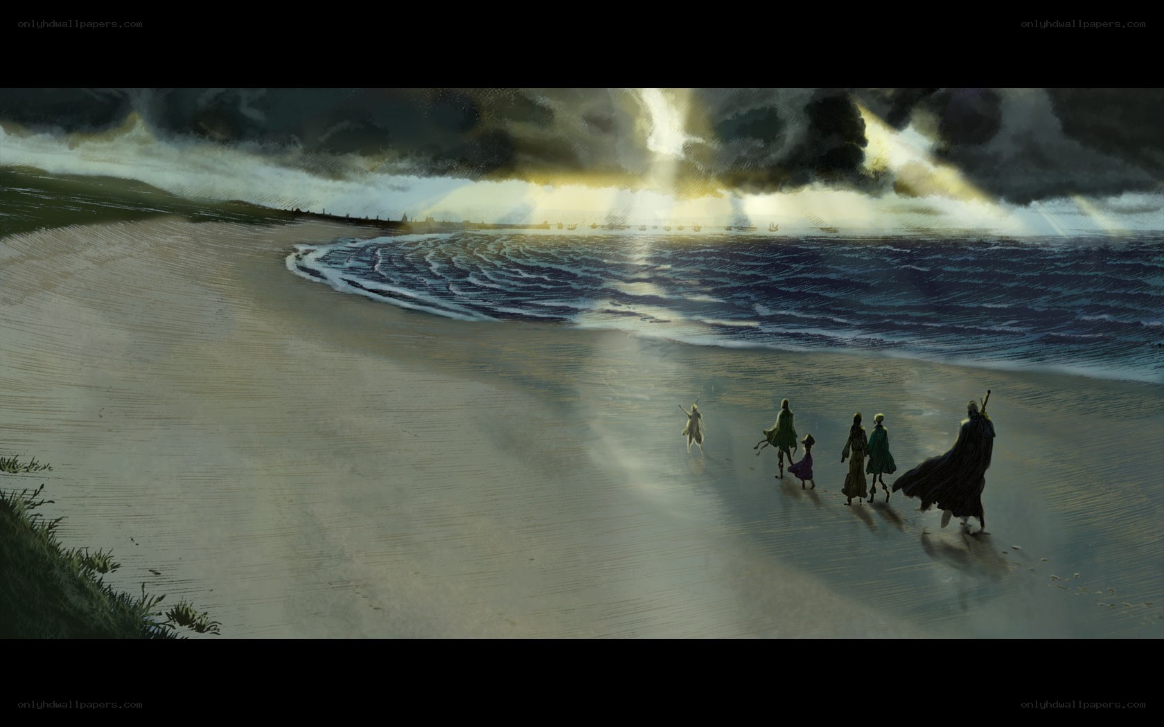 Group walks on beach at sunset