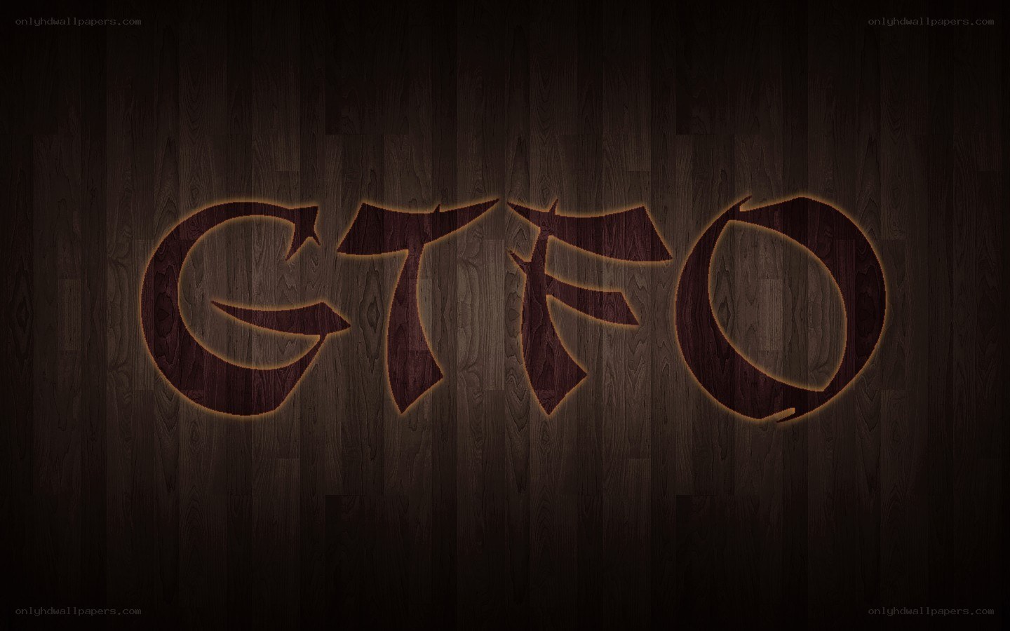 GTFO logo on wood