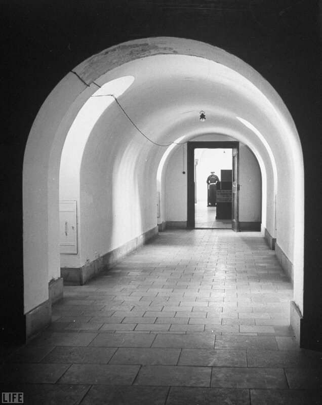 Guard in a stone corridor