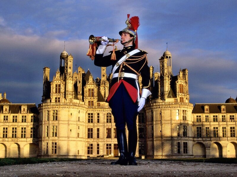 Guard playing trumpet at Chambord