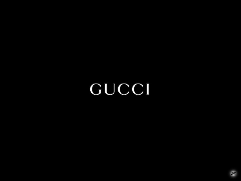 Gucci logo on black background