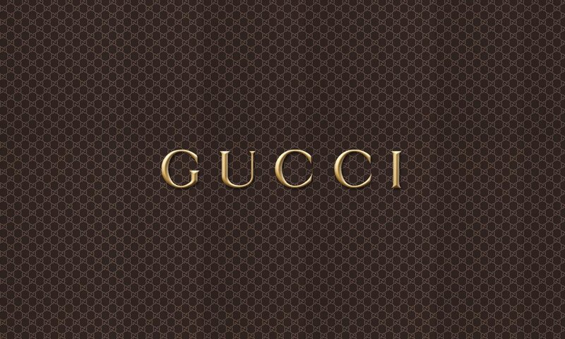 Gucci logo on patterned background