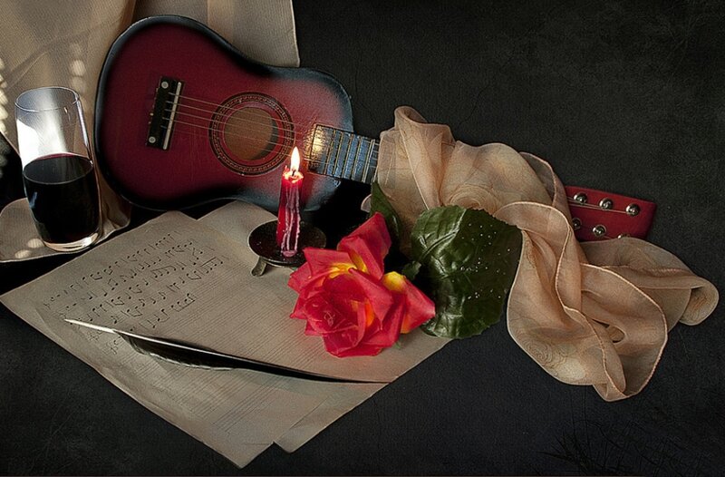 Guitar and Rose on Table