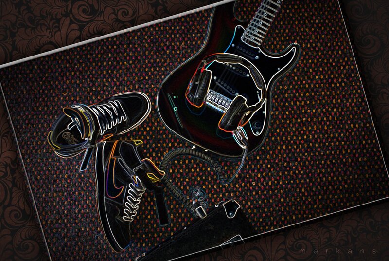 Guitar and sneakers on patterned surface