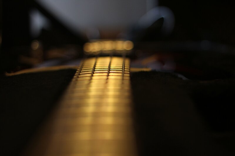 guitar fretboard in low light