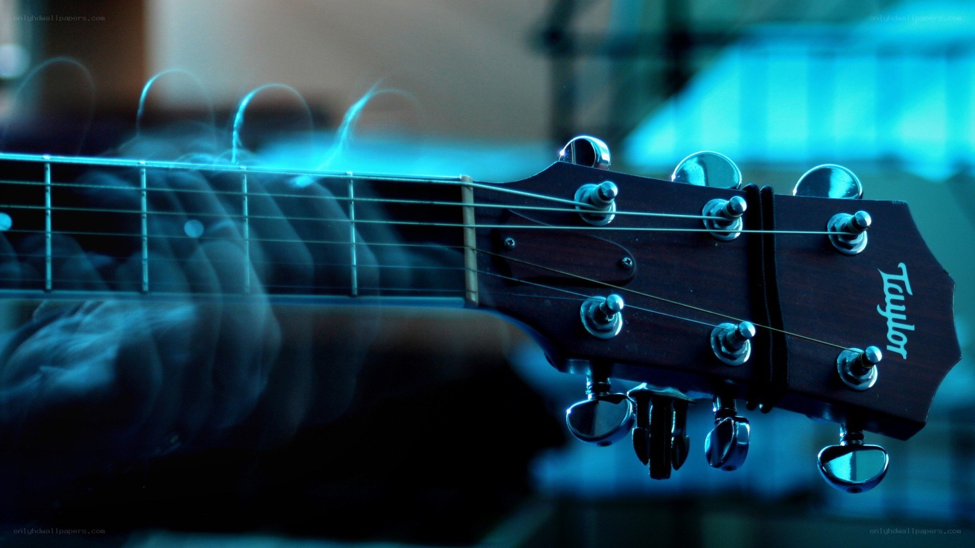 Guitar headstock with hand playing